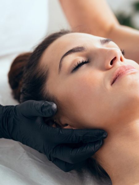 Woman receiving advanced facial treatment with exosomes and fractional radiofrequency at Skin Solutions Marbella